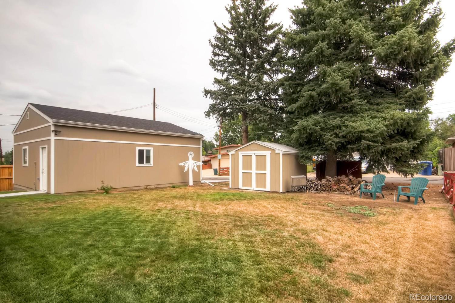 3660 Hoyt Court Wheat Ridge, CO 80033 - Photo 26 of 28 a front view of a house with a yard