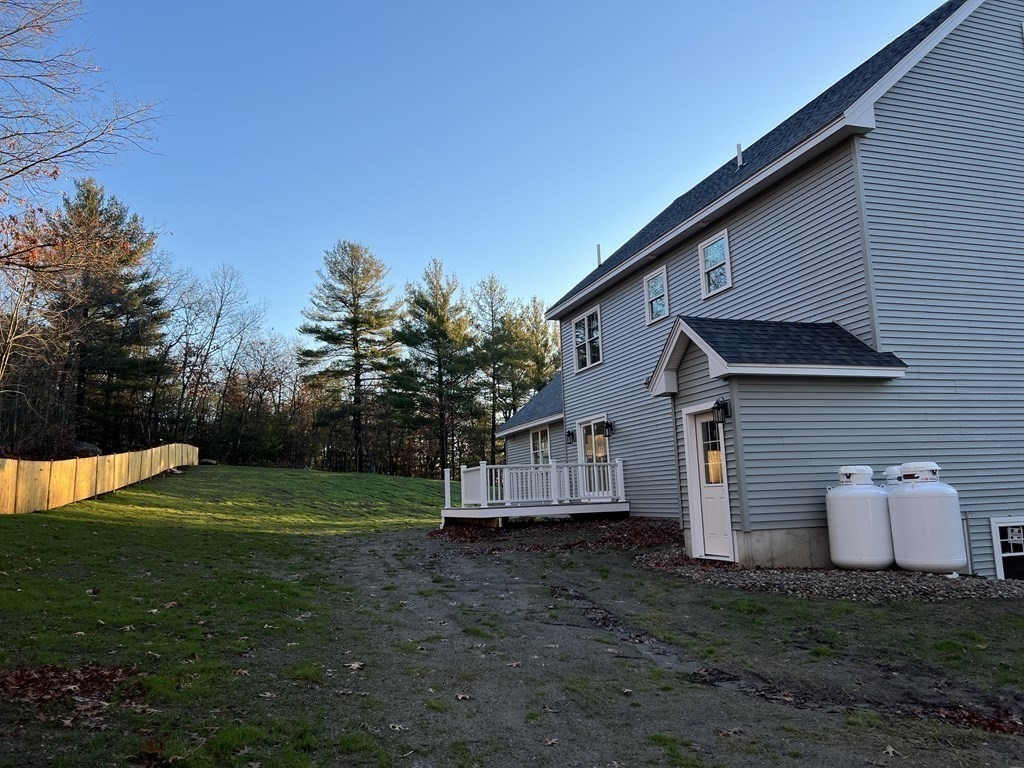 178 Andover Road Billerica, MA 01821 - Photo 2 of 39 a front view of a house with a yard