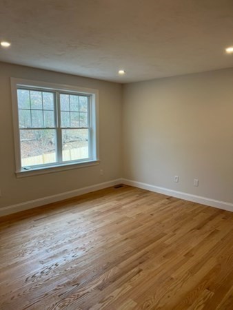 178 Andover Road Billerica, MA 01821 - Photo 25 of 39 a view of an empty room with wooden floor and a window