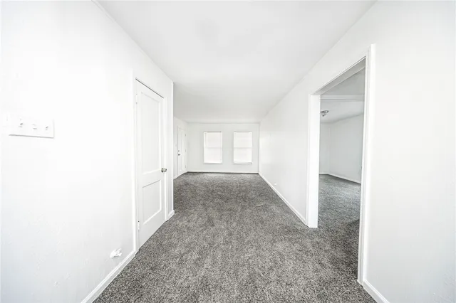 a view of hallway with windows