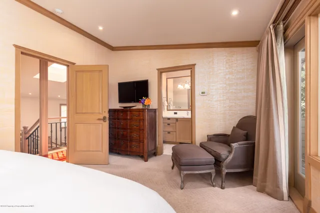 a bedroom with a bed and furniture