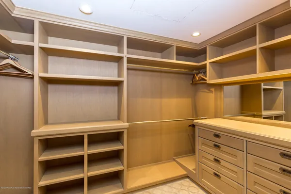 a view of an empty walk in closet