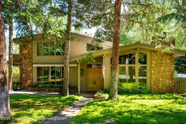 front view of a house with a yard