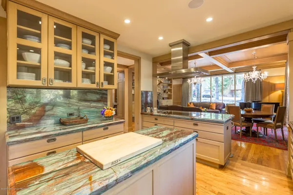a kitchen with a stove a sink and a refrigerator