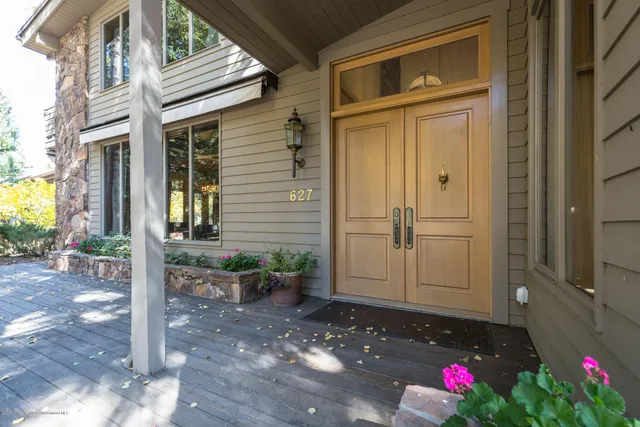 a view of a house with a potted plant