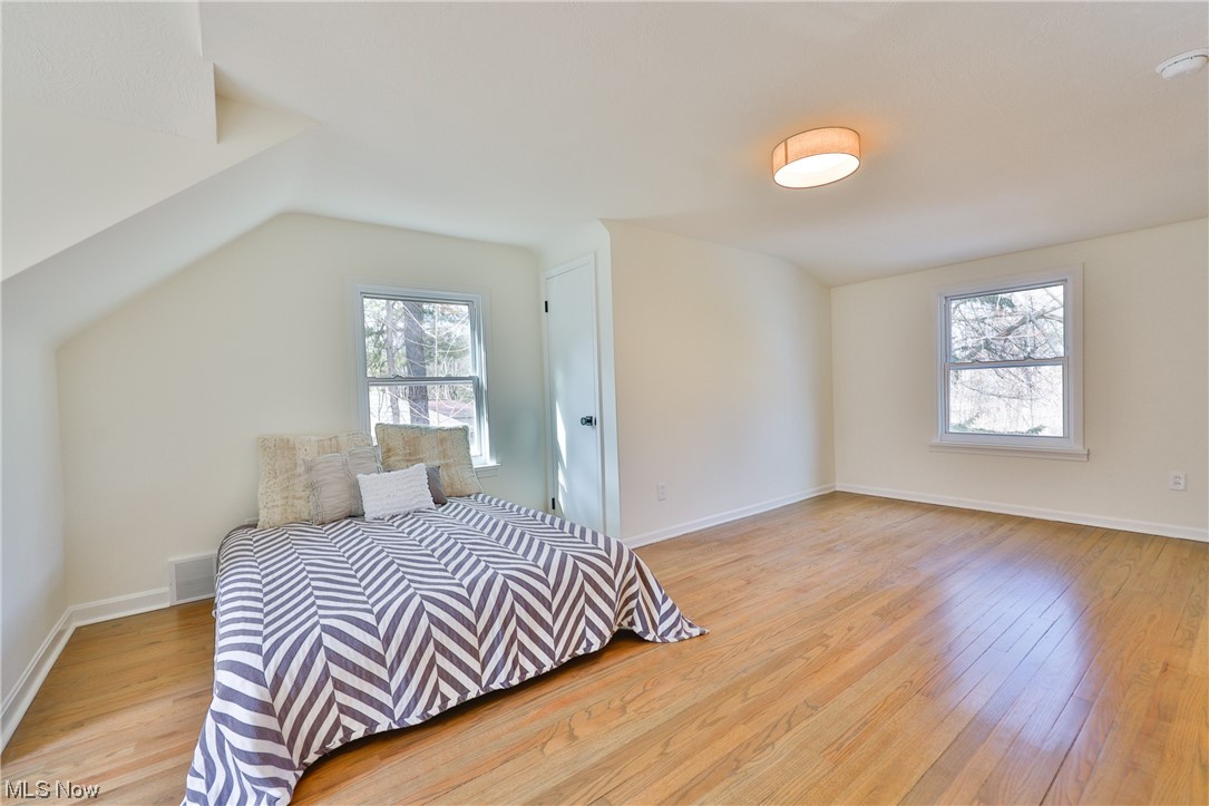 32887 Cedar Road Mayfield Heights, OH 44124 - Photo 25 of 44 Bedroom with light hardwood / wood-style floors and vaulted ceiling