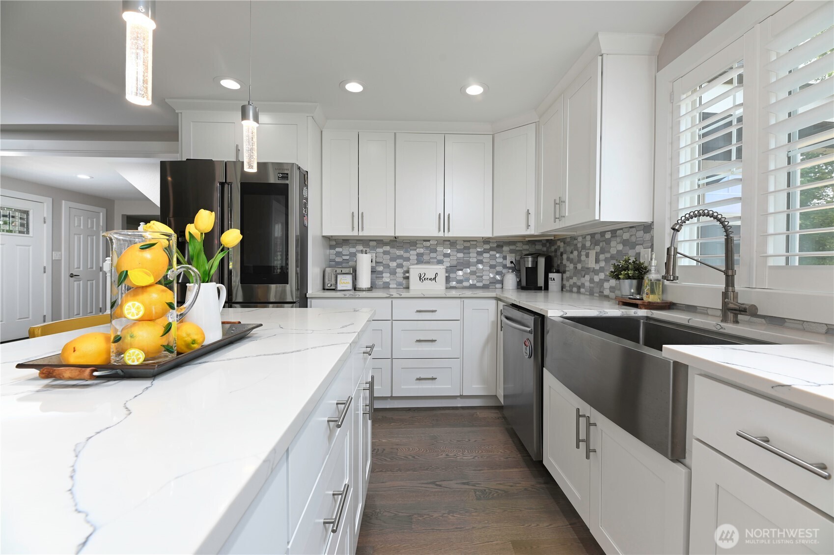 12523 Woods Lake Road Monroe, WA 98272 - Photo 12 of 40 a kitchen that has a lot of white cabinets and stainless steel appliances
