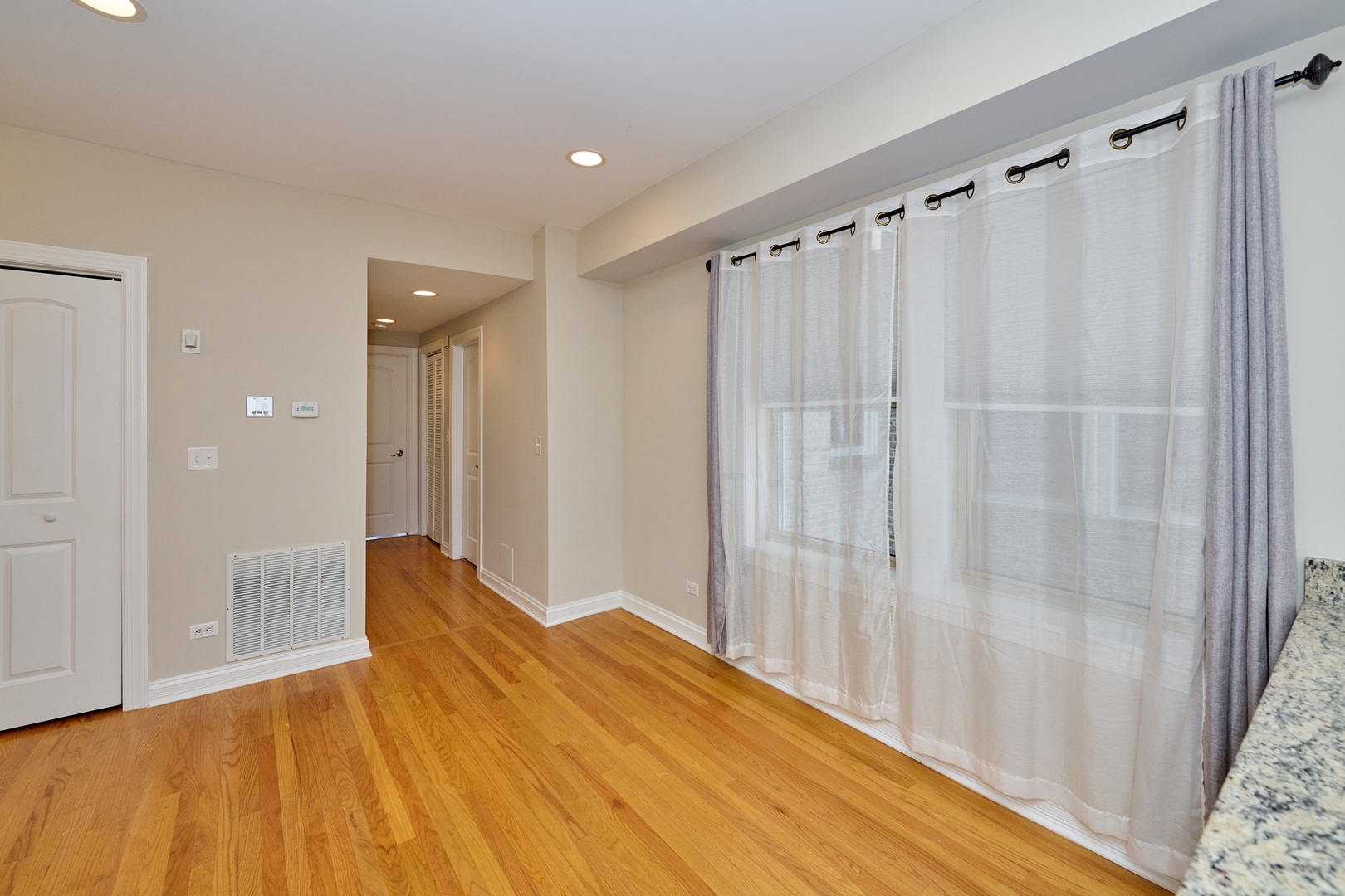 5715 North Kimball Avenue, Unit 1N Chicago, IL 60659 - Photo 15 of 36 a view of a room with wooden floor