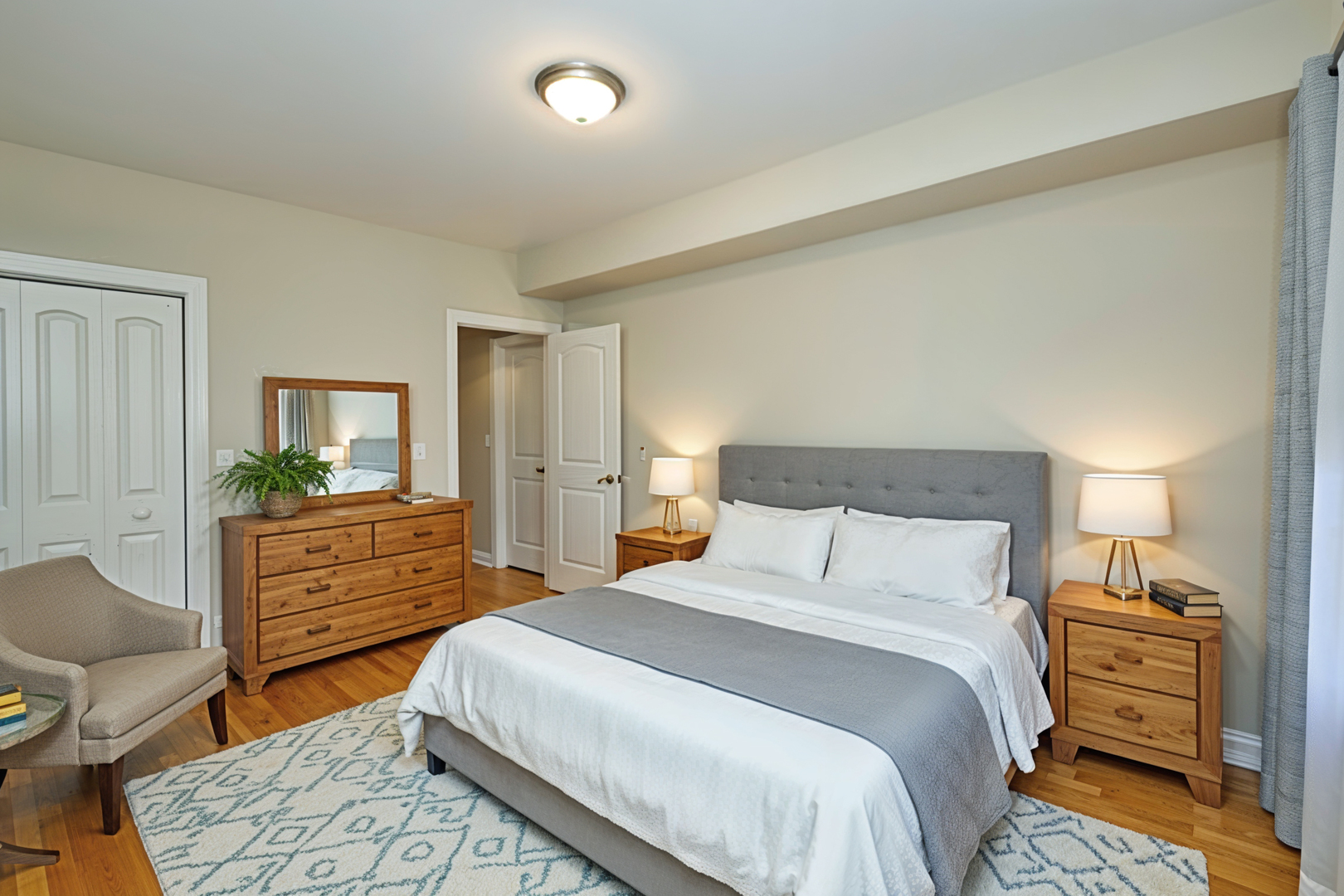 5715 North Kimball Avenue, Unit 1N Chicago, IL 60659 - Photo 17 of 36 a bedroom with a bed and a dresser in it