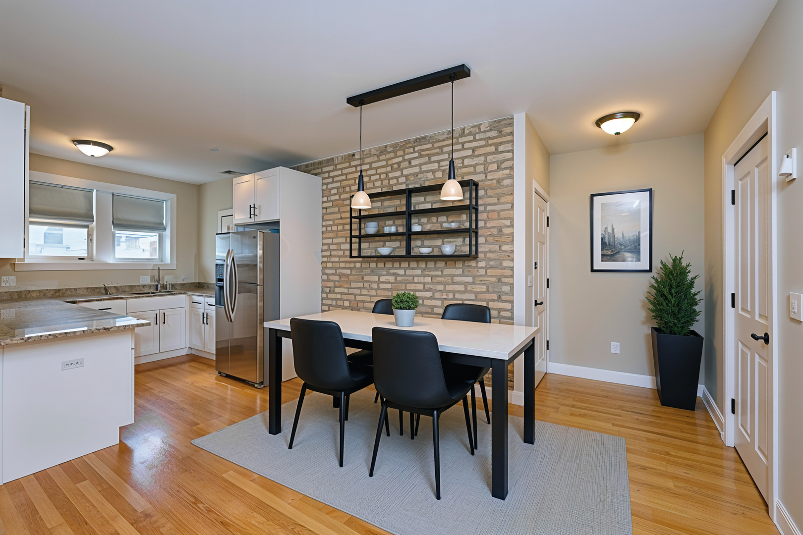 5715 North Kimball Avenue, Unit 1N Chicago, IL 60659 - Photo 3 of 36 a dining room with furniture and window