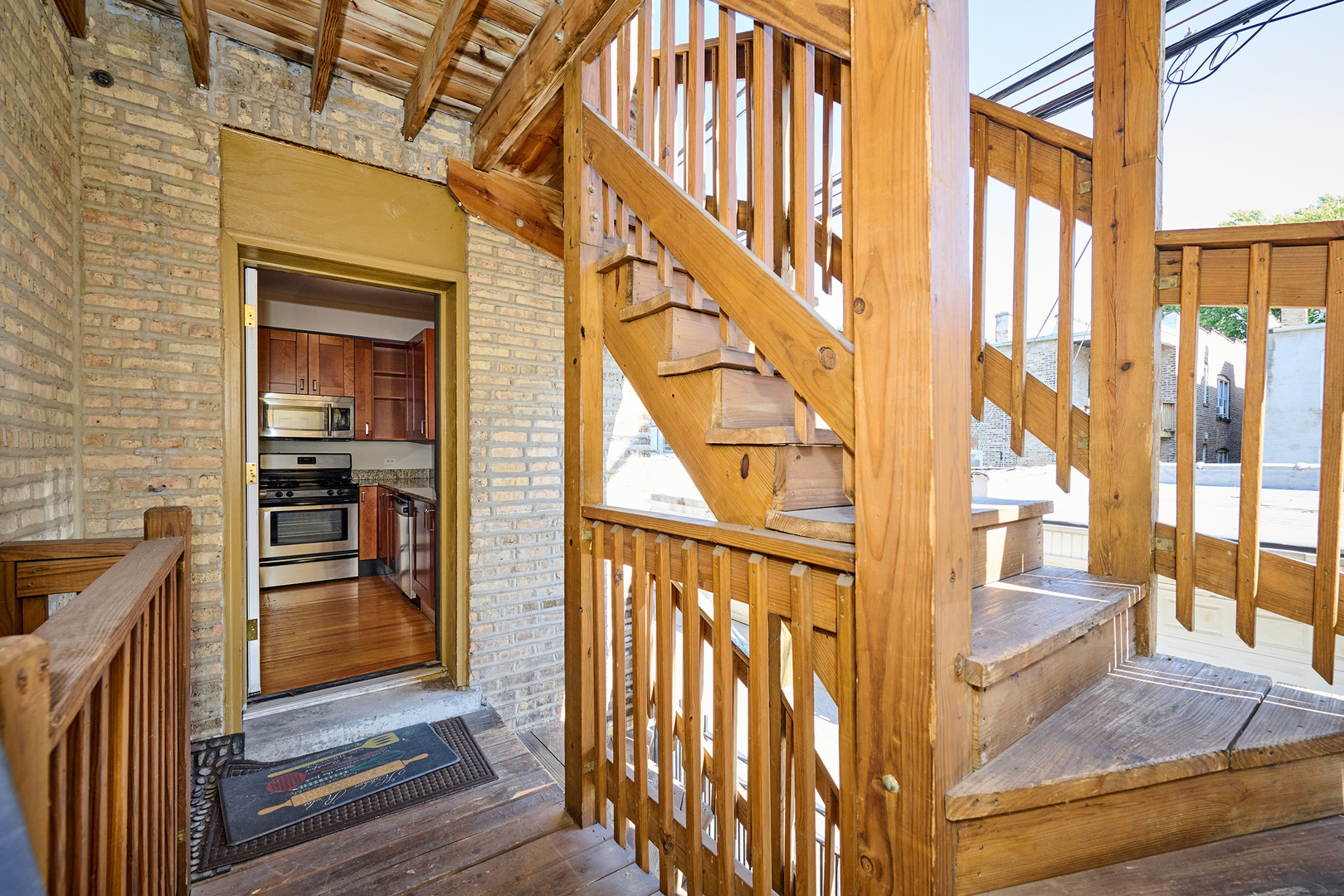 5715 North Kimball Avenue, Unit 1N Chicago, IL 60659 - Photo 33 of 36 a view of an entryway with wooden floor and door
