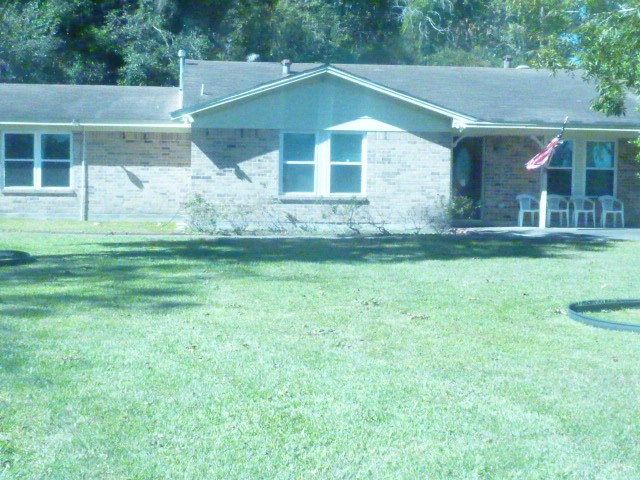 a view of a back yard of the house