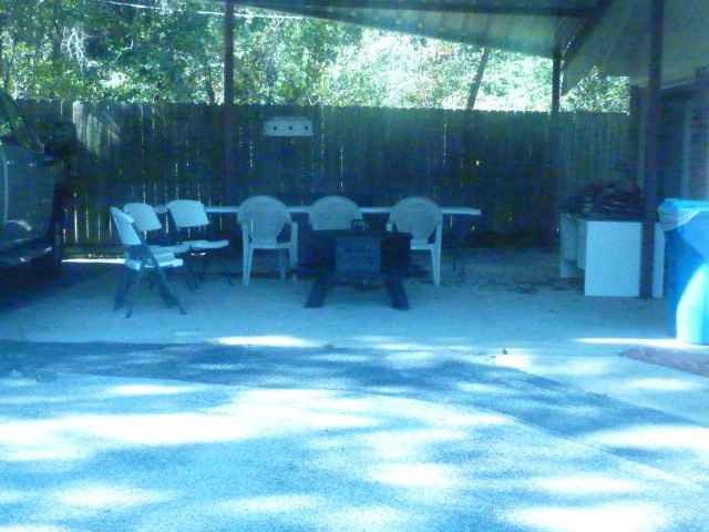 3978 Highway 59 Cleveland, TX 77328 - Photo 6 of 20 a view of a porch with chairs and a yard