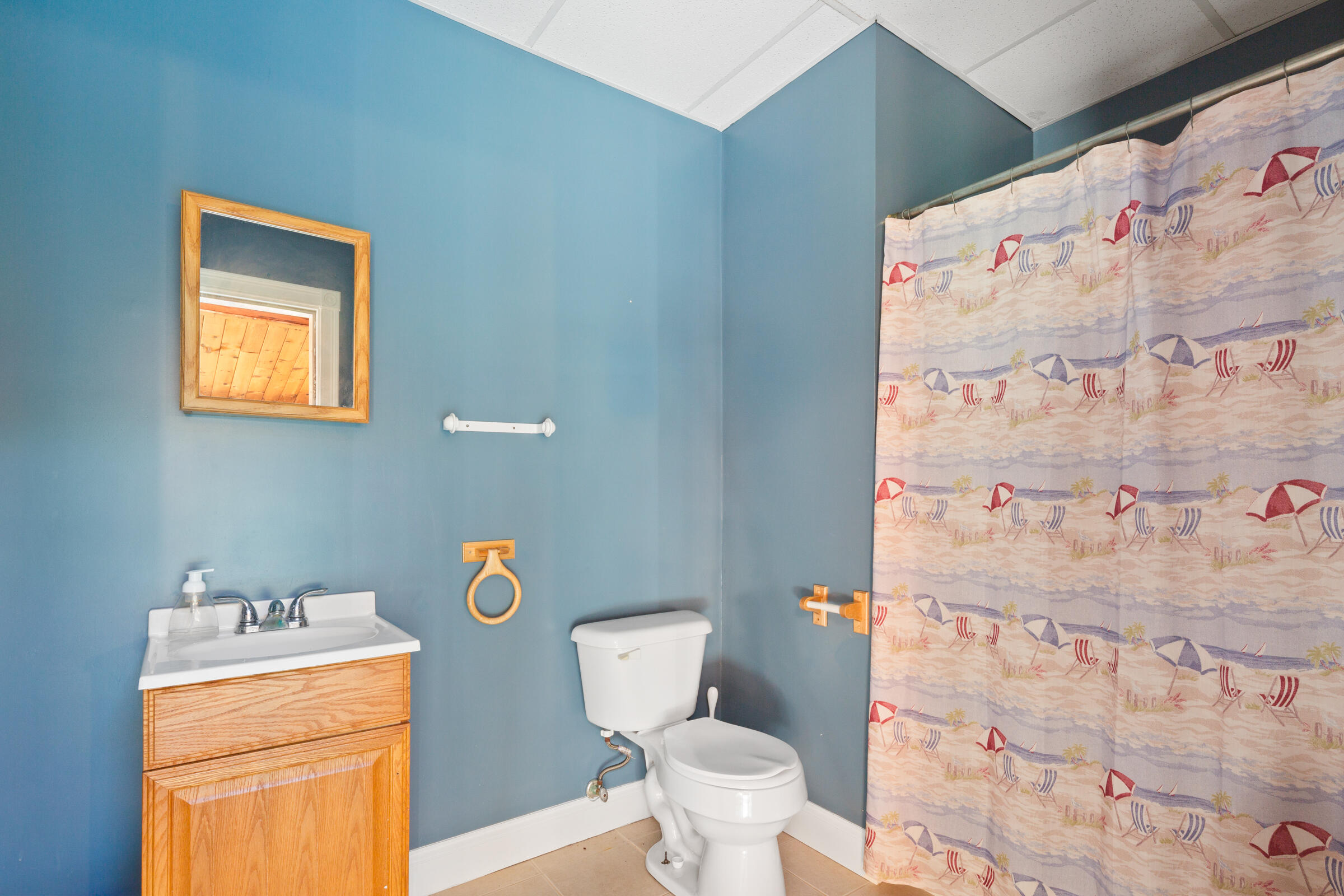 8 Desmond Road Sagamore, MA 02561 - Photo 27 of 71 a bathroom with a toilet and a shower curtain