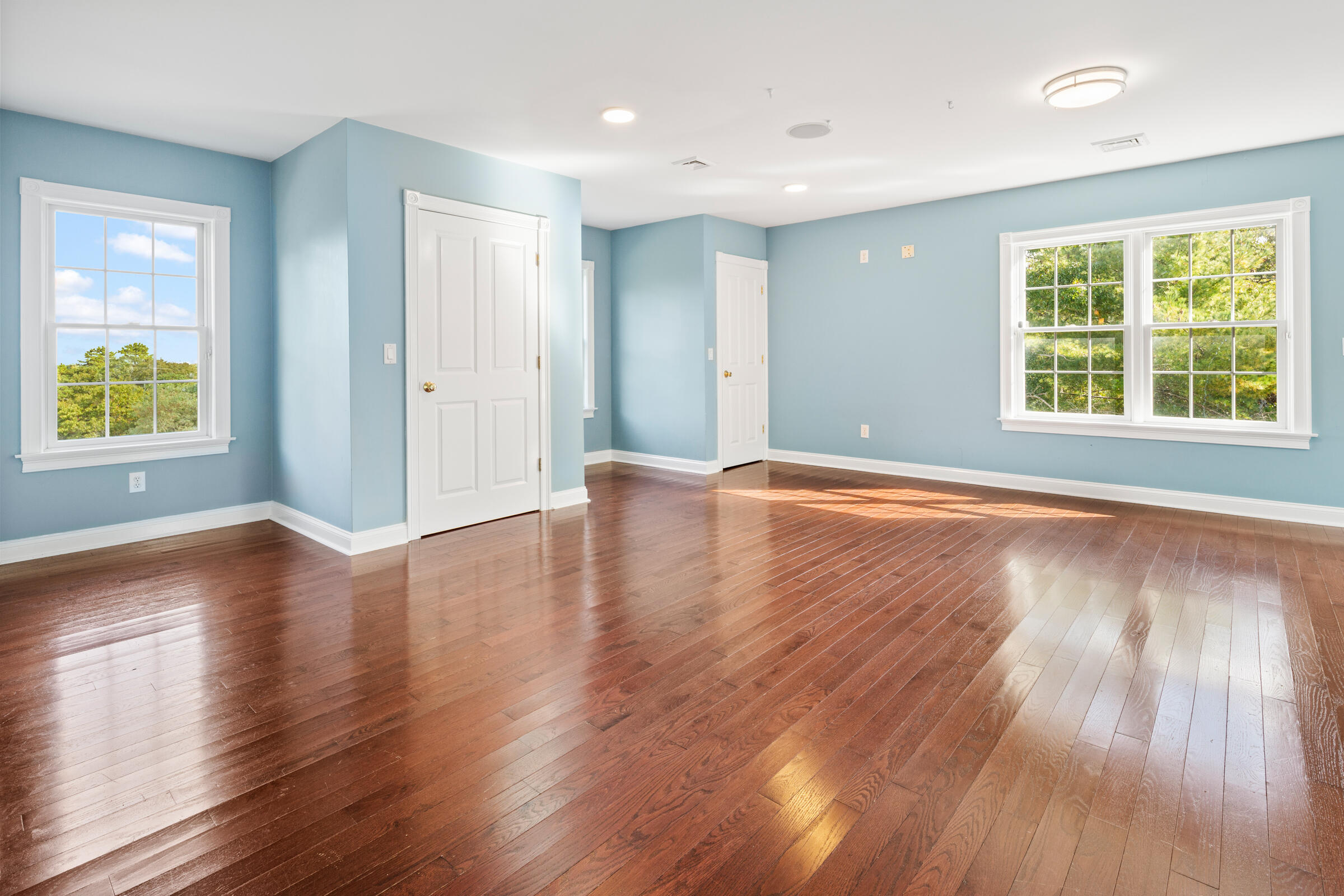 8 Desmond Road Sagamore, MA 02561 - Photo 45 of 71 a view of an empty room with wooden floor and a window