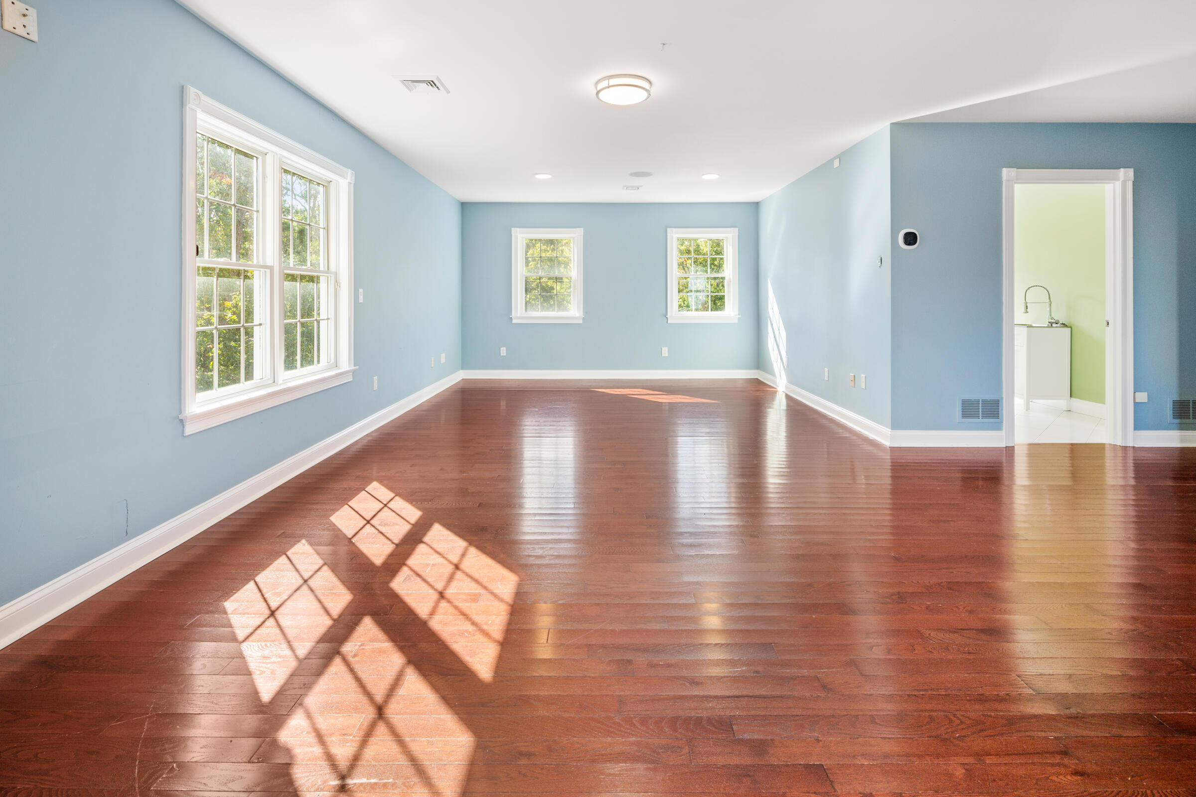 8 Desmond Road Sagamore, MA 02561 - Photo 47 of 71 a view of an empty room with wooden floor and a window