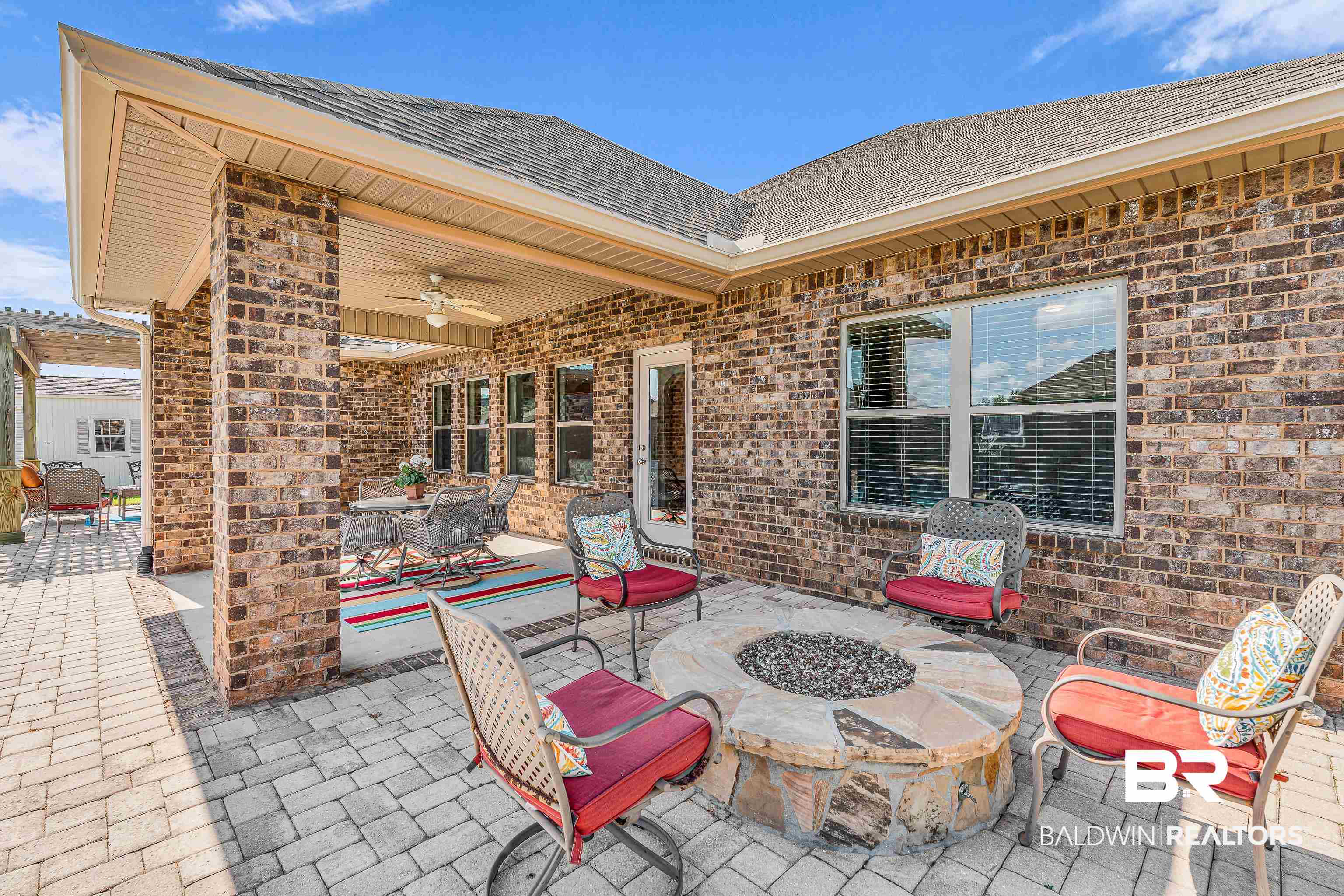 9675 Camberwell Drive Daphne, AL 36526 - Photo 26 of 34 View of patio / terrace featuring a ceiling fan and an outdoor fire pit