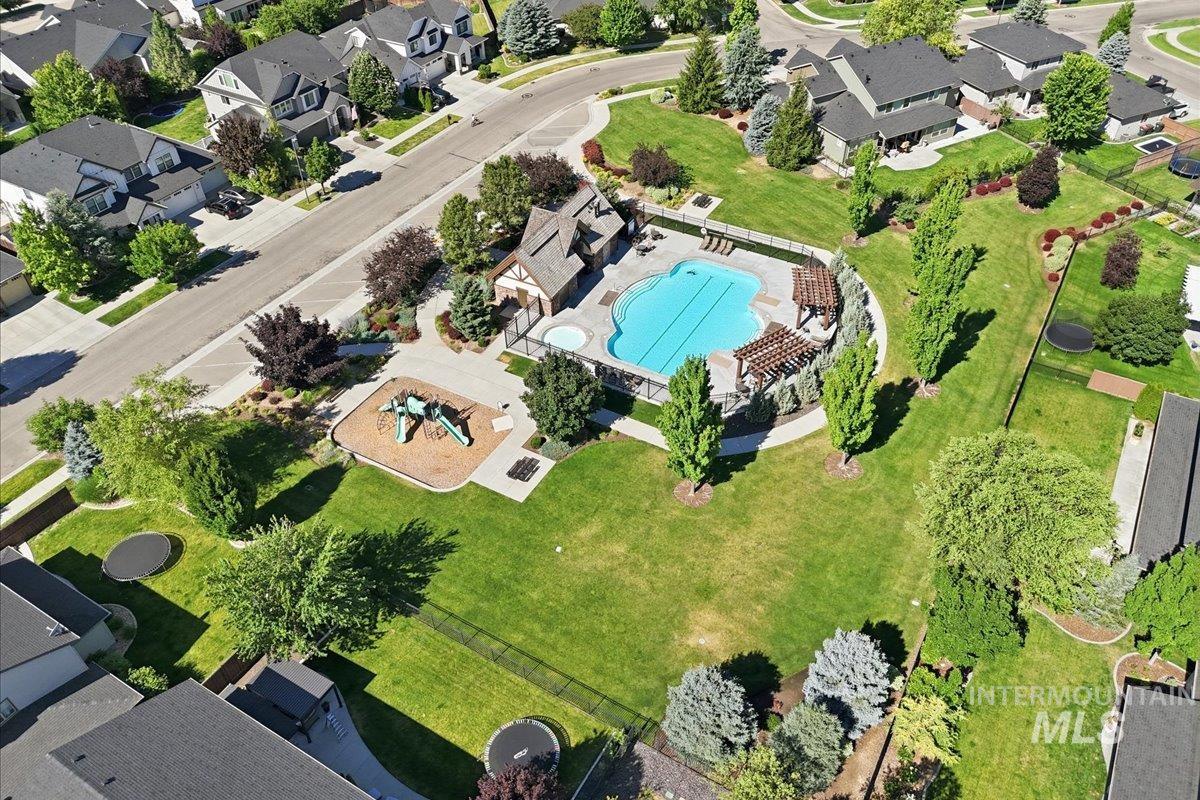 1303 West Brando Street Meridian, ID 83646 - Photo 46 of 49 Community amenity area featuring a swimming pool, spa, pergola, and playground