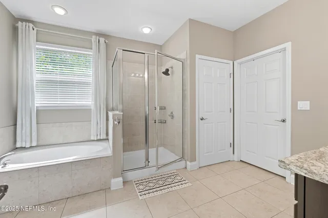 a bathroom with a shower and a bathtub