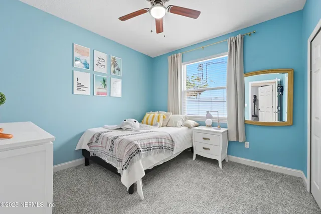 a bed room with a bed and a window