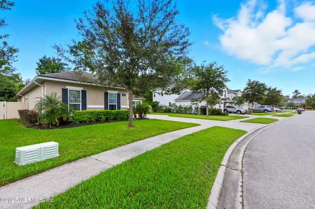 a view of a house with a big yard