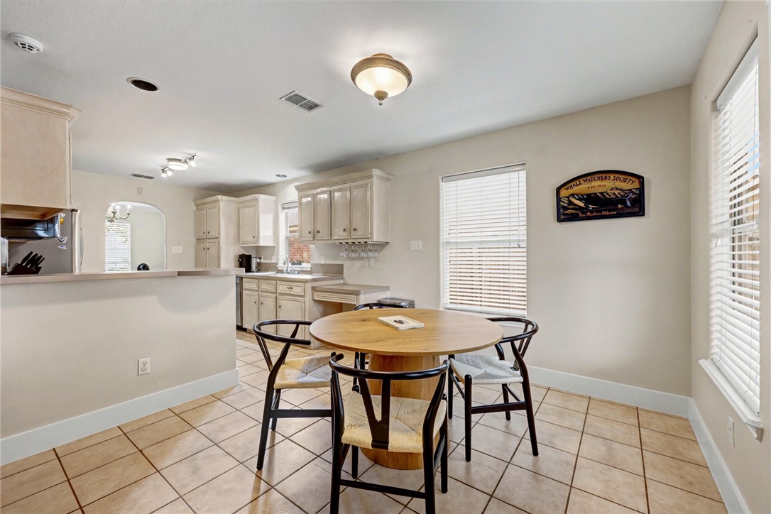 7541 Yorkshire Drive Corpus Christi, TX 78413 - Photo 11 of 32 a view of a dining room with furniture and a chandelier