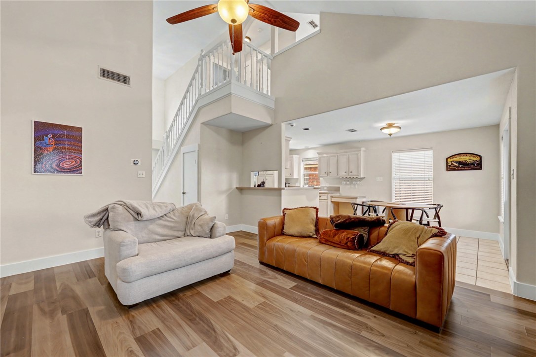 7541 Yorkshire Drive Corpus Christi, TX 78413 - Photo 13 of 32 a living room with furniture and a chandelier