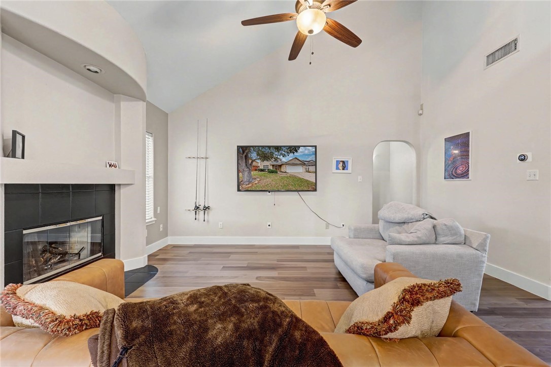 7541 Yorkshire Drive Corpus Christi, TX 78413 - Photo 15 of 32 a bedroom with a bed and a fireplace