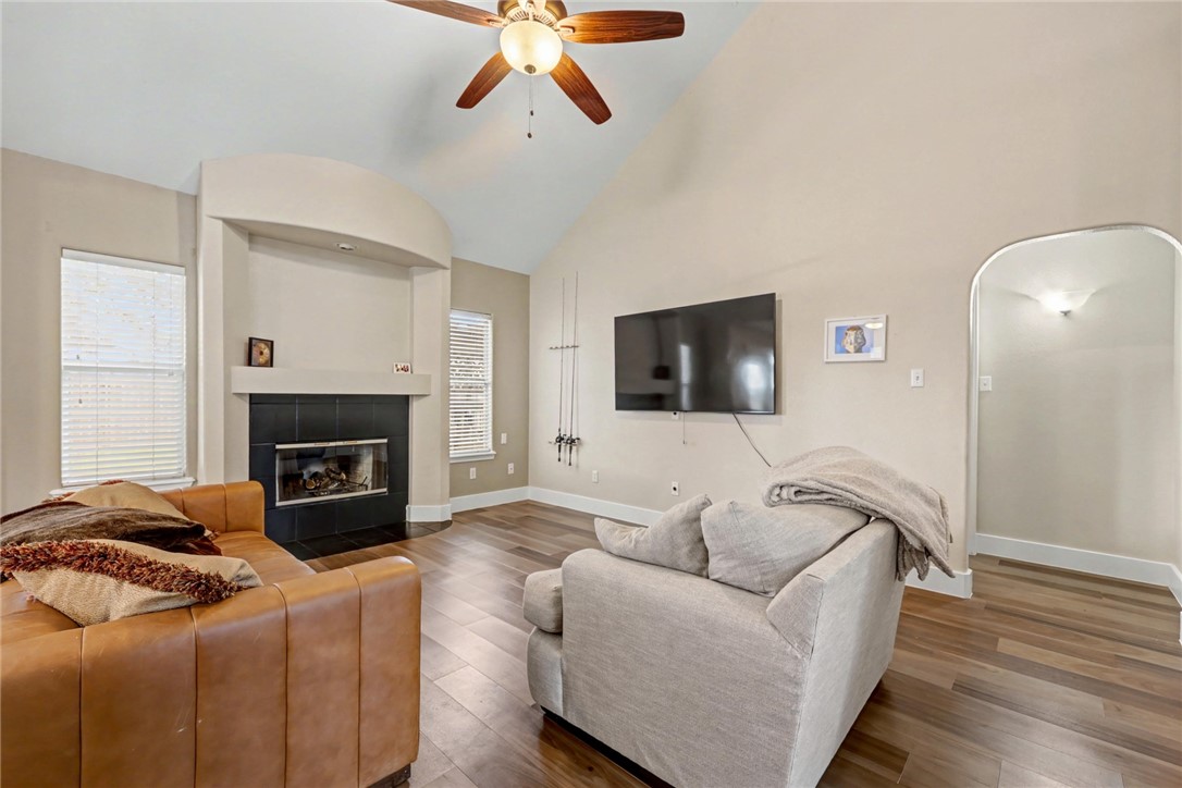 7541 Yorkshire Drive Corpus Christi, TX 78413 - Photo 16 of 32 a living room with furniture and a fireplace
