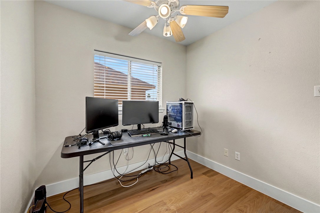 7541 Yorkshire Drive Corpus Christi, TX 78413 - Photo 25 of 32 a view of a workspace with furniture and a window