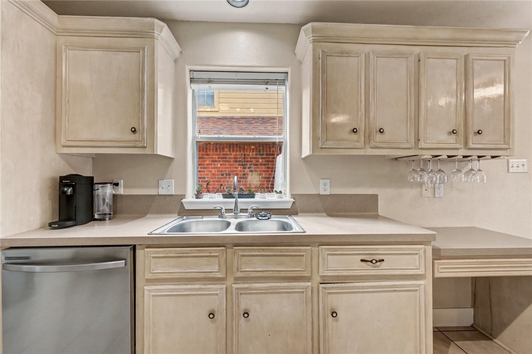 7541 Yorkshire Drive Corpus Christi, TX 78413 - Photo 7 of 32 a kitchen with granite countertop white cabinets and white appliances