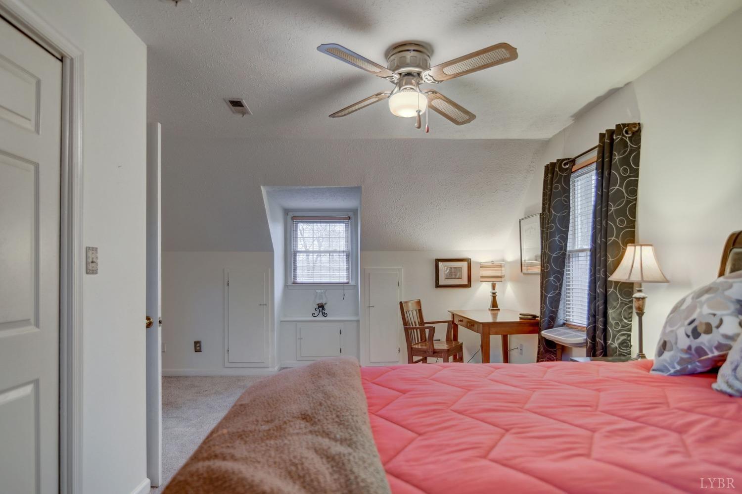 161 River Ridge Road Madison Heights, VA 24572 - Photo 20 of 36 a bedroom with a bed and a chandelier