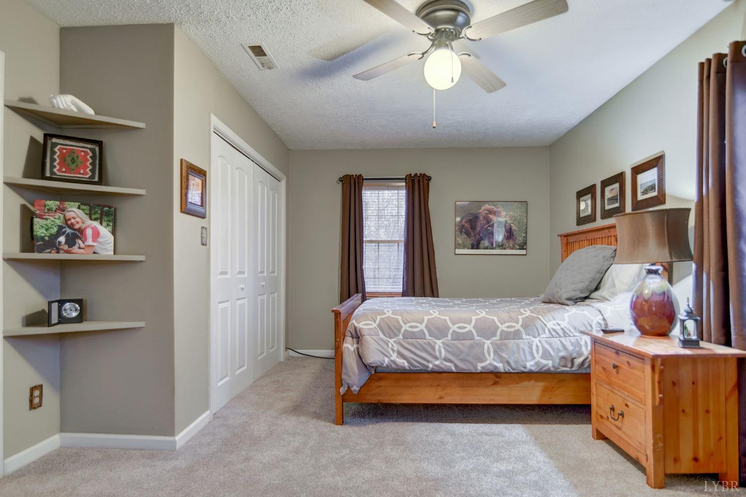 161 River Ridge Road Madison Heights, VA 24572 - Photo 23 of 36 a bedroom with a bed and cabinets