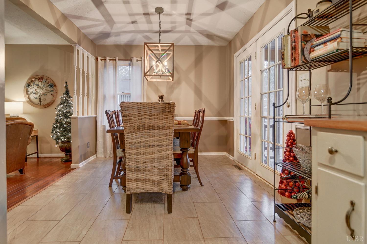 161 River Ridge Road Madison Heights, VA 24572 - Photo 7 of 36 a view of a dining room with furniture and a chandelier