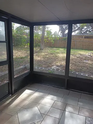 a view of a room with a large window