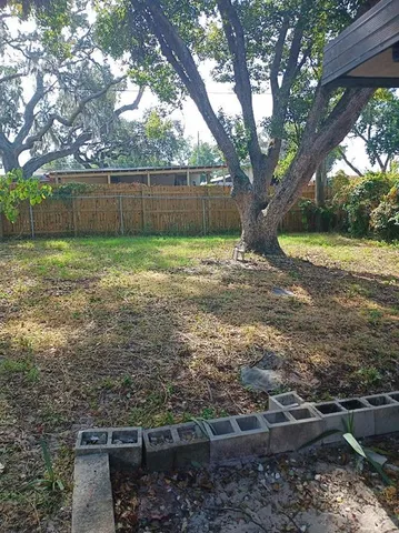 a view of backyard with green space