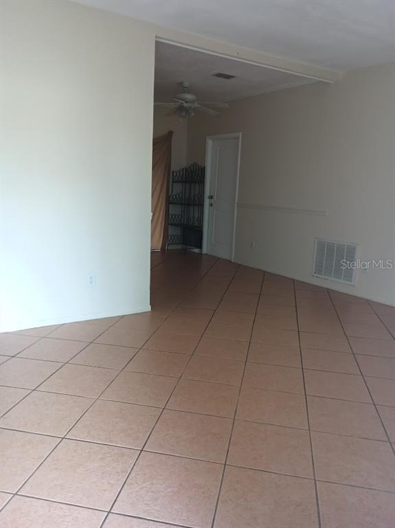 6726 Carnelian Avenue New Port Richey, FL 34653 - Photo 2 of 13 a view of an empty room with a window