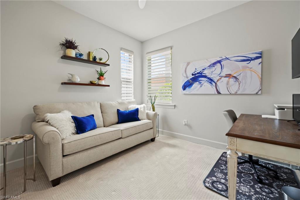 10231 Glastonbury Circle, Unit 101 Fort Myers, FL 33913 - Photo 16 of 35 a living room with furniture and a couch