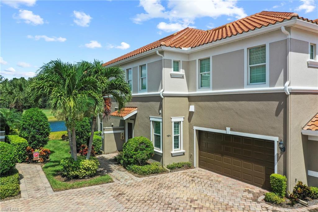 10231 Glastonbury Circle, Unit 101 Fort Myers, FL 33913 - Photo 26 of 35 a front view of a house with garden