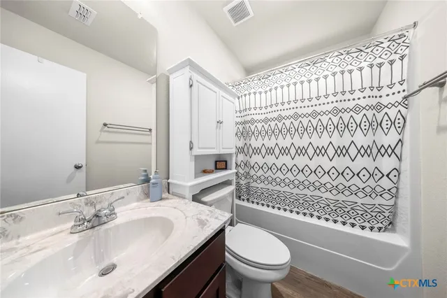 a bedroom with a bed and dresser