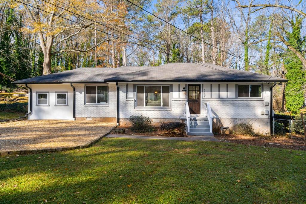 3308 Bobolink Drive Decatur, GA 30032 - Photo 1 of 1 a view of a house with a backyard and a patio