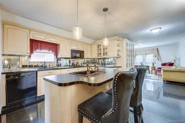 a large kitchen with a table and chairs