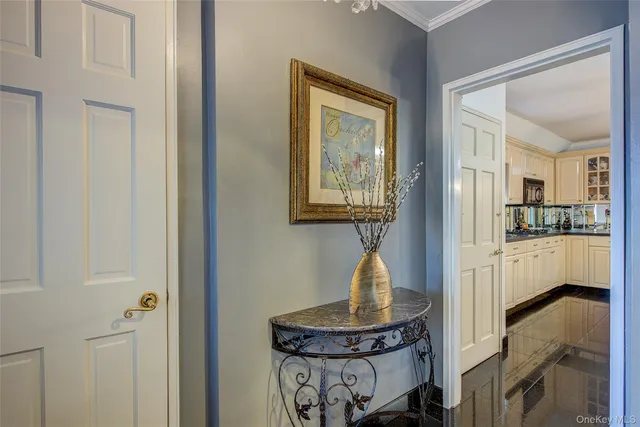 a view of hallway with livingroom and furniture