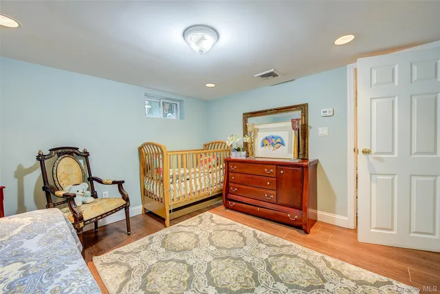 a bedroom with furniture and a window