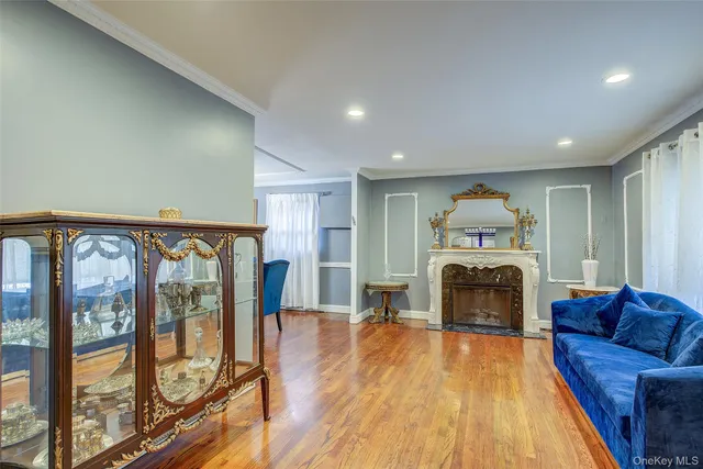 a view of living room with furniture and fireplace