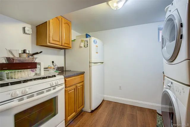 a kitchen with stainless steel appliances a stove a microwave and a refrigerator