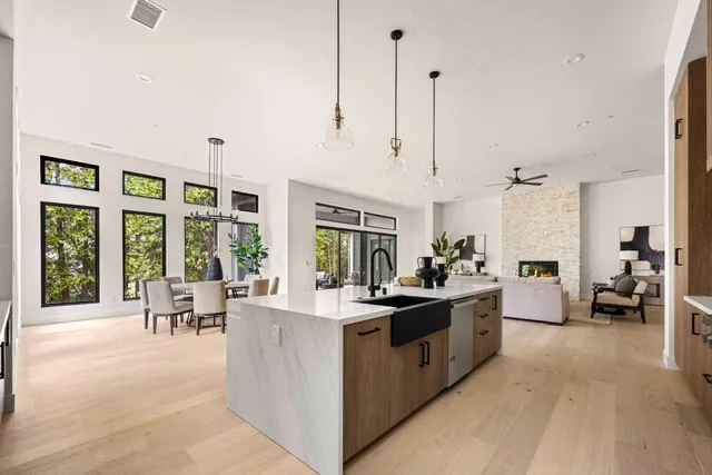 a view of living room with furniture and large windows