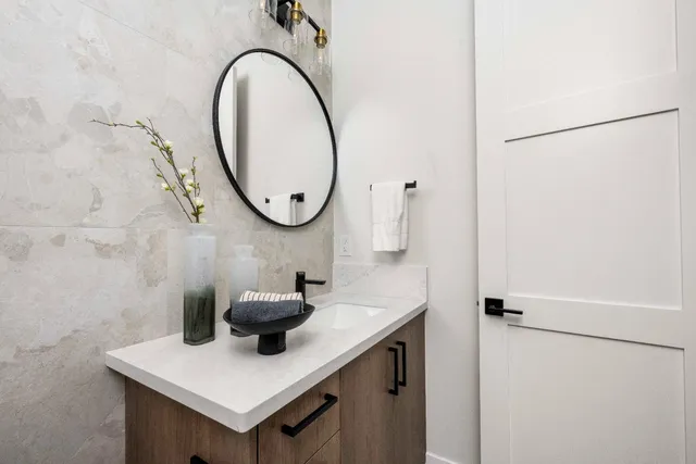 a bathroom with a sink and a mirror