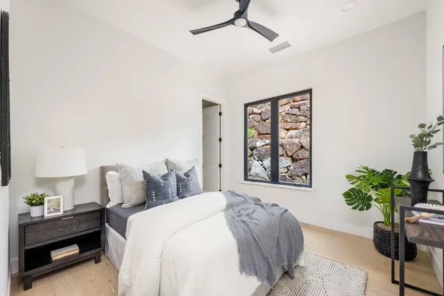 a bedroom with furniture and a window