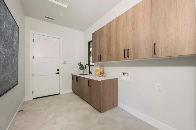 a view of cabinets with wooden floor